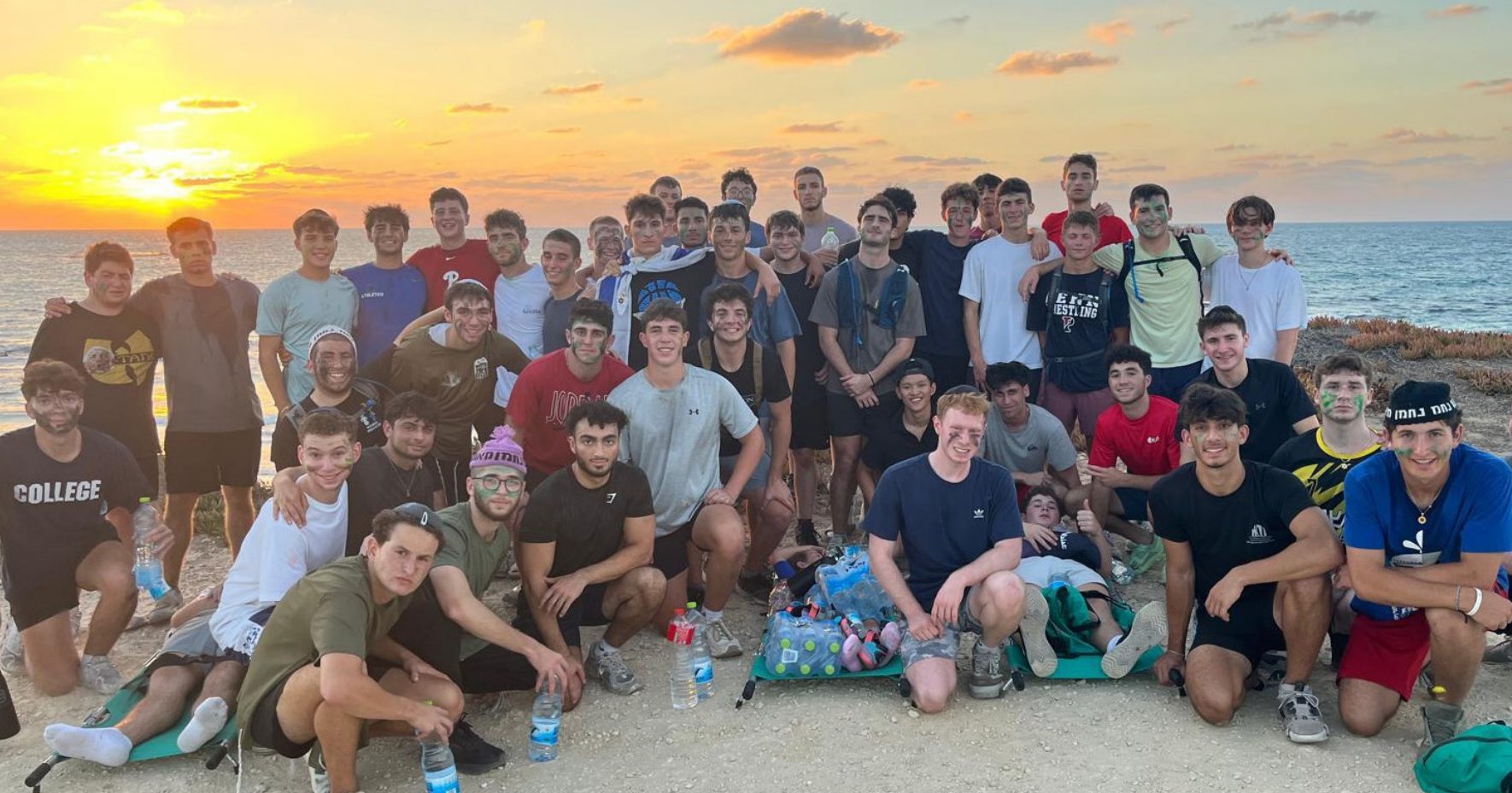 The whole yeshiva together on the beach at sunset